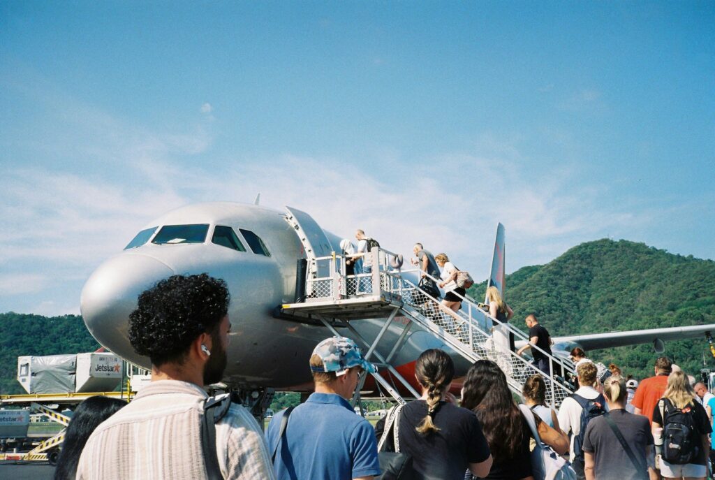 A group of passengers boarding a plane