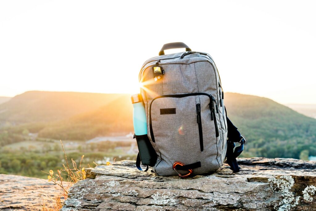 A travel backpack on a rock