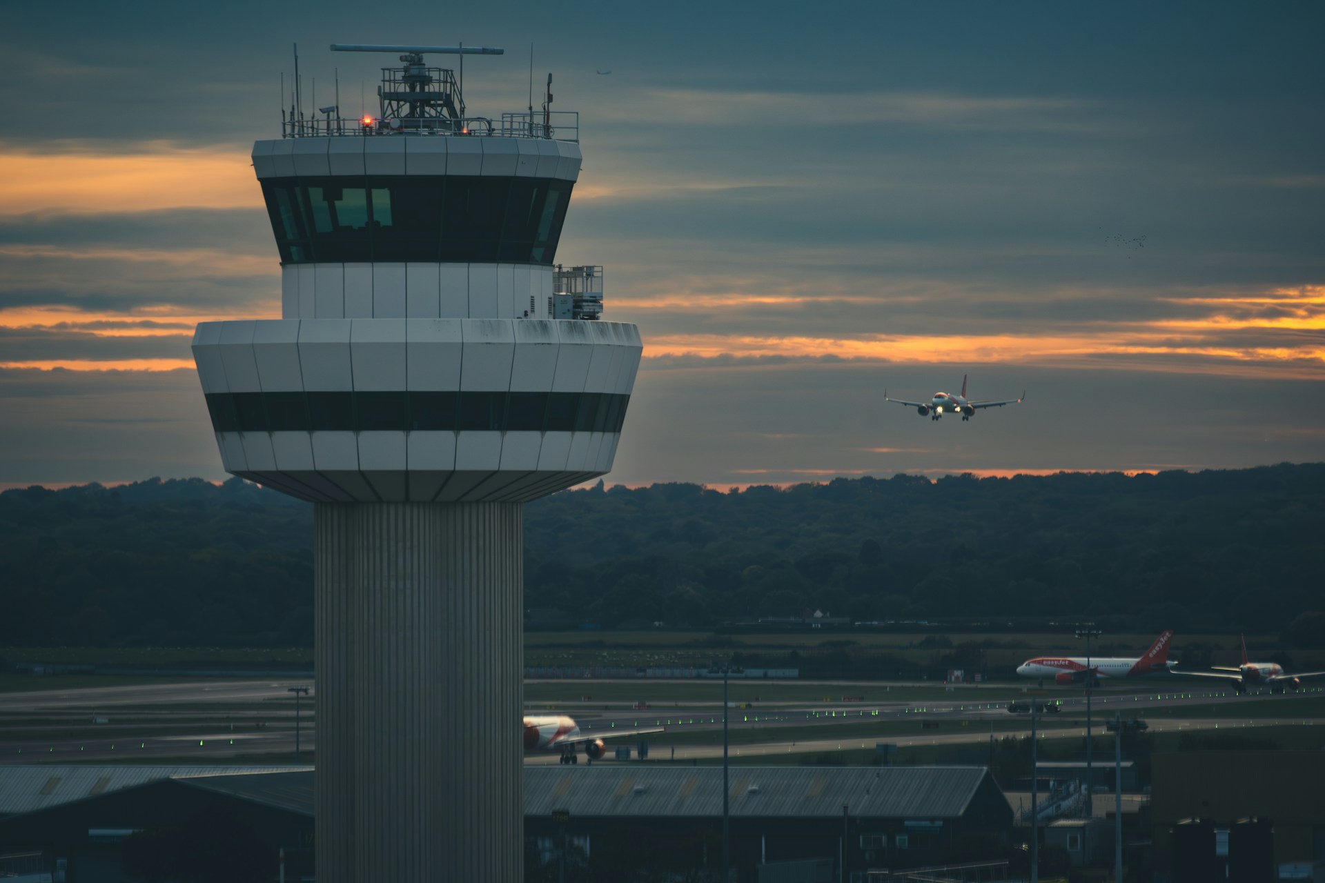 Lookout tower with aeroplane in the distance