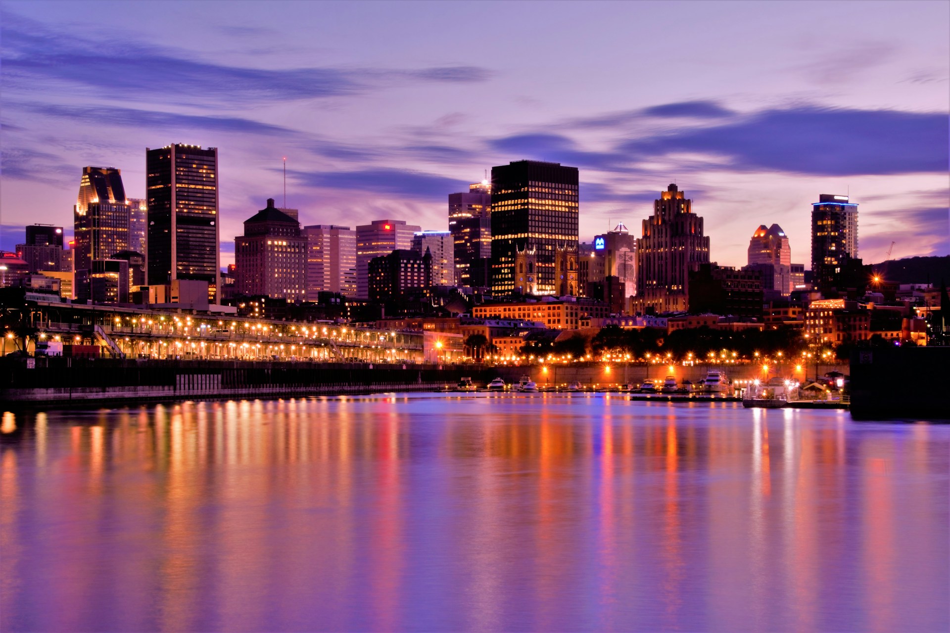 Nighttime cityscape of Montreal over water