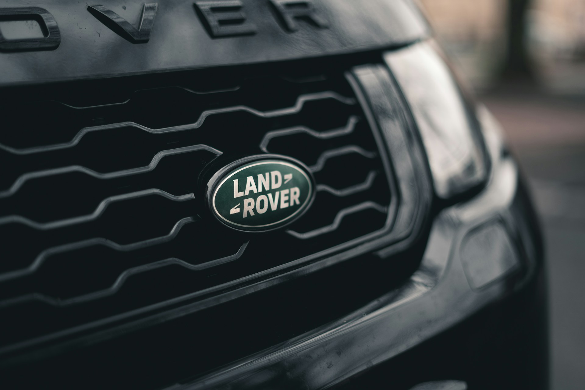 A close up of a Land Rover grill and logo