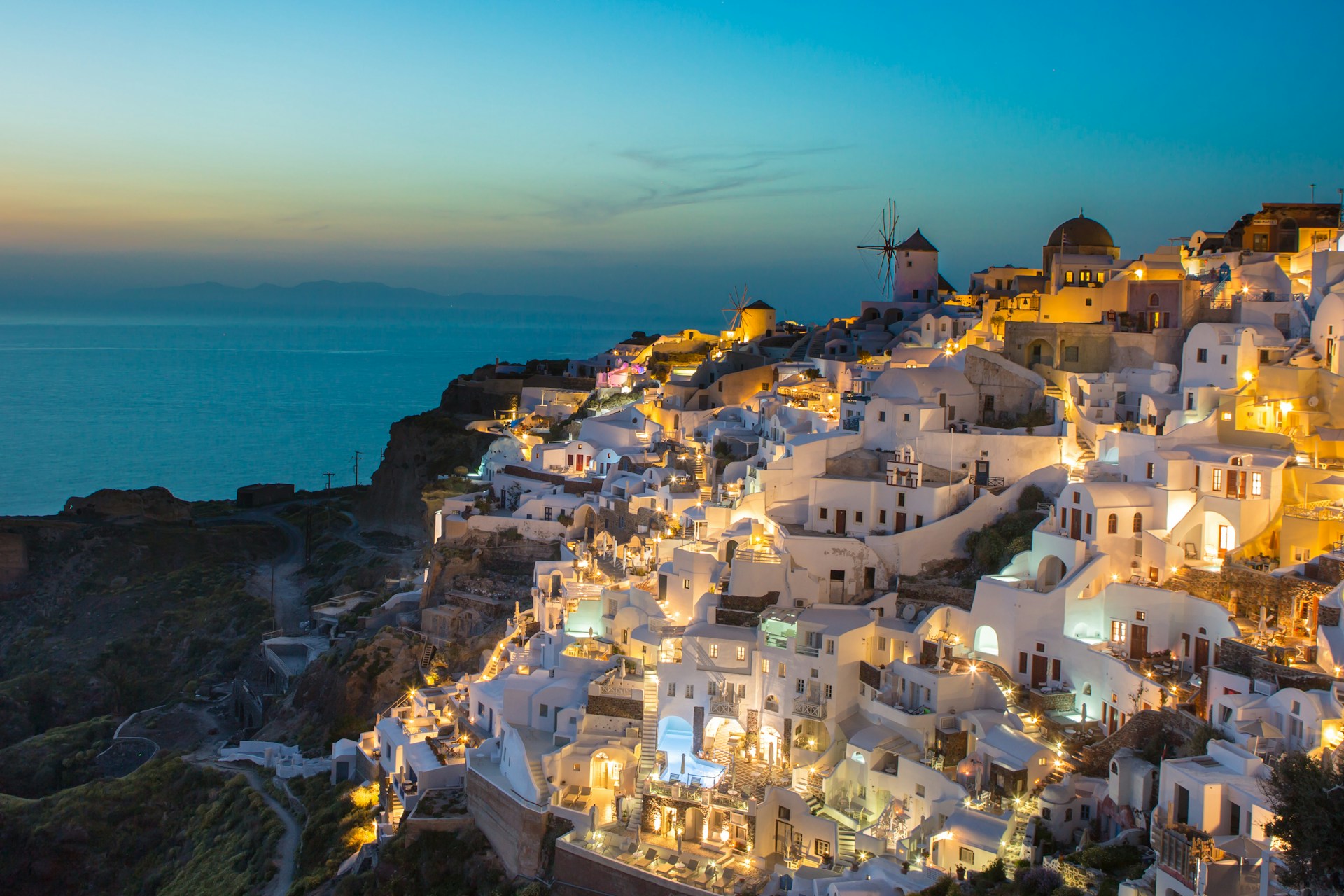 Santorini's bay lit up at night